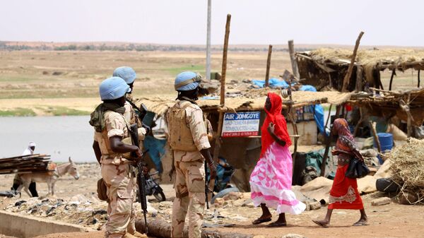 Senegalese soldiers of the UN peacekeeping mission in Mali MINUSMA (United Nations Multidimensional Integrated Stabilisation Mission in Mali) patrol on foot in the streets of Gao, on July 24, 2019 - Sputnik International