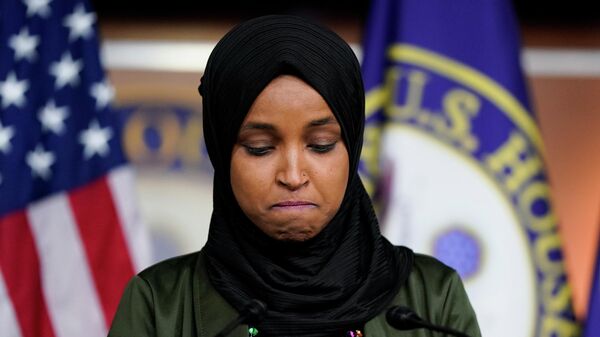 U.S. Representative Ilhan Omar (D-MN) reacts as she speaks during a news conference addressing the anti-Muslim comments made by Representative Lauren Boebert (R-CO) towards Omar, on Capitol Hill in Washington, U.S., November 30, 2021. - Sputnik International