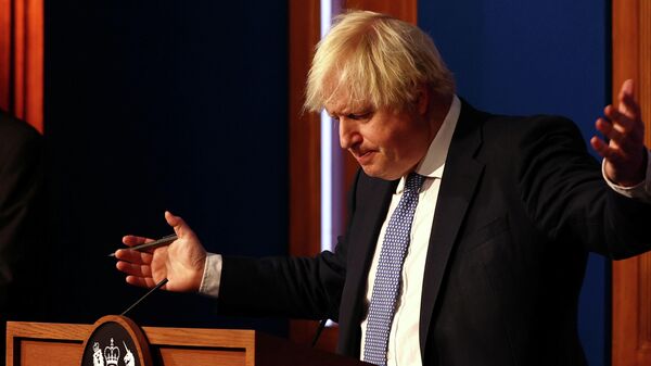 British Prime Minister Boris Johnson holds a news conference for the latest coronavirus disease (COVID-19) update in the Downing Street briefing room, in London, Britain December 8, 2021.  - Sputnik International