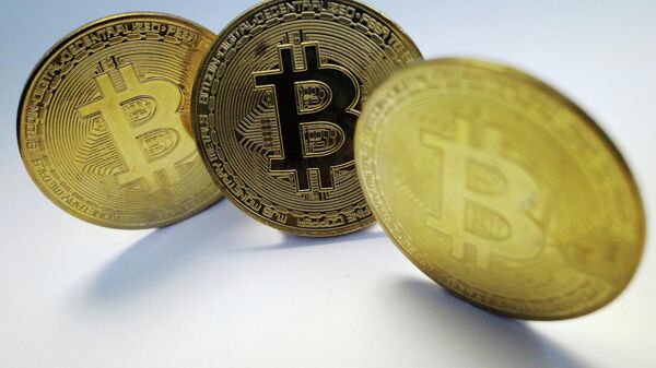 A representation of the virtual cryptocurrency Bitcoin is seen in this picture illustration taken October 19, 2021.  - Sputnik International
