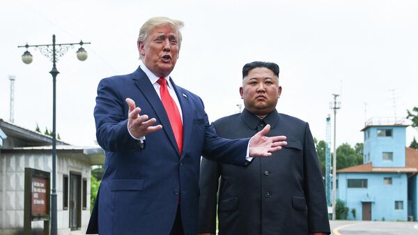 US President Donald Trump speaks as he stands with North Korea's leader Kim Jong Un south of the Military Demarcation Line that divides North and South Korea, in the Joint Security Area (JSA) of Panmunjom in the Demilitarized zone (DMZ) on June 30, 2019 - Sputnik International