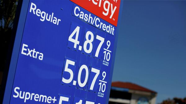 Gas prices grow along with inflation as this sign at a gas station shows in San Diego, California, U.S. November, 9, 2021.  REUTERS/Mike Blake/File Photo - Sputnik International