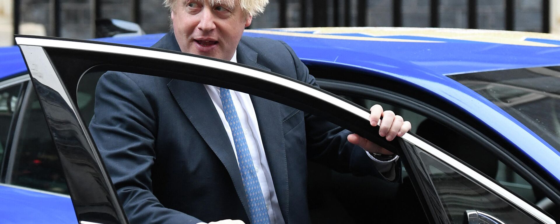 Britain's Prime Minister Boris Johnson gets into an electric vehicle during a meeting with Small Business Saturday entrepreneurs in Downing Street in central London on December 1, 2021 - Sputnik International, 1920, 13.12.2021