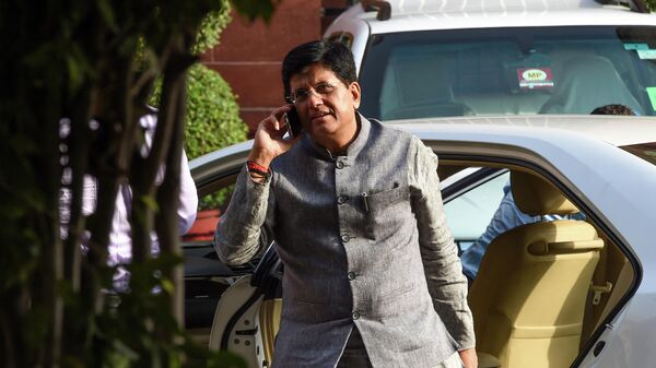 Indian minister of Railways and Commerce and Industry Piyush Goyal talks on the phone as he arrives to attend a meeting with the newly-named cabinet in New Delhi on May 31, 2019 - Sputnik International