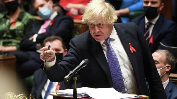 A handout photograph released by the UK Parliament shows Britain's Prime Minister Boris Johnson gesturing as he speaks during Prime Minister's Questions (PMQs) in the House of Commons in London on December 1, 2021 - Sputnik International