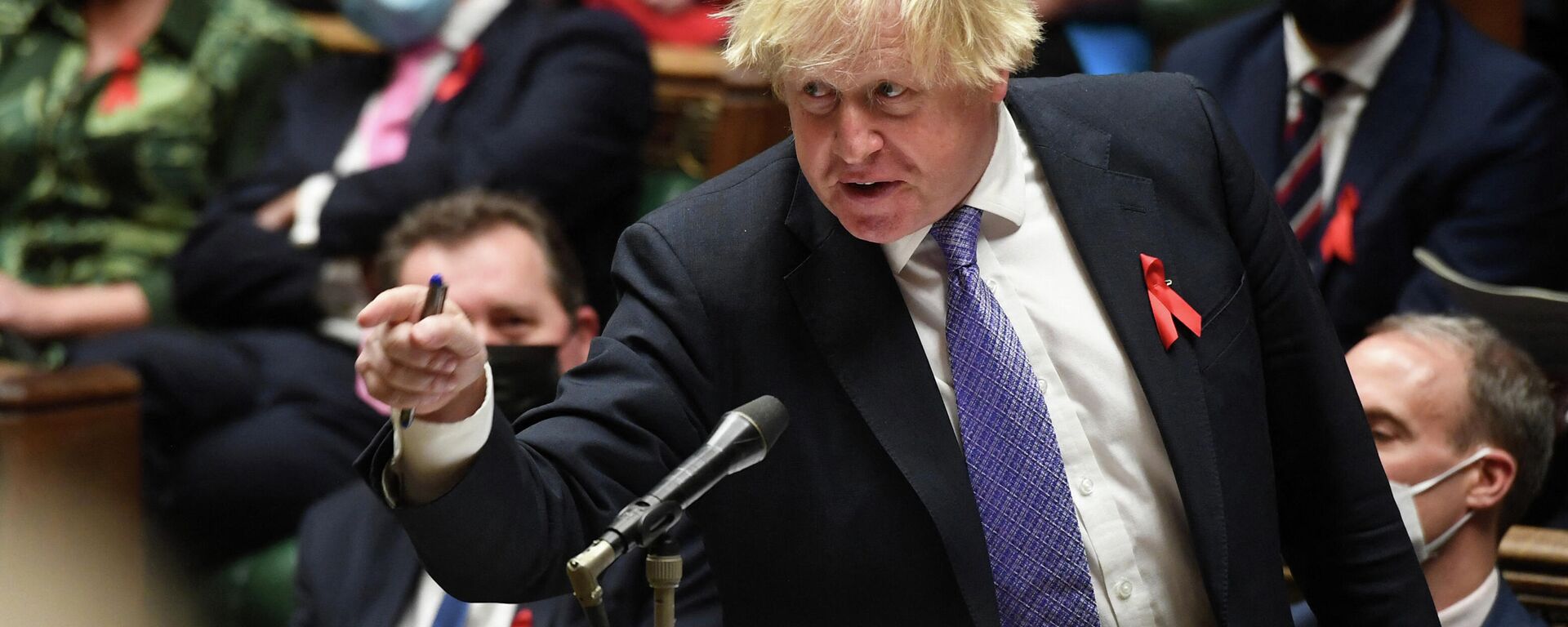 A handout photograph released by the UK Parliament shows Britain's Prime Minister Boris Johnson gesturing as he speaks during Prime Minister's Questions (PMQs) in the House of Commons in London on December 1, 2021 - Sputnik International, 1920, 17.12.2021