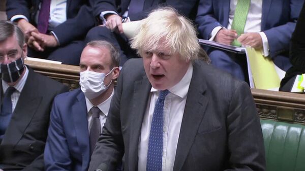 British Prime Minister Boris Johnson speaks during the weekly question time debate at Parliament in London, Britain, December 15, 2021 - Sputnik International