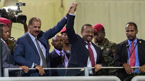 In this Sunday July 15, 2018 file photo, Eritrean President Isaias Afwerki, second left, and Ethiopia's Prime Minister Abiy Ahmed, center, hold hands as they wave at the crowds in Addis Ababa, Ethiopia. Once official rivals, the leaders of Ethiopia and Eritrea have embraced warmly to the roar of a crowd of thousands at a concert celebrating the end of a long state of war. The 2019 Nobel Peace Prize was given to Ethiopian Prime Minister Abiy Ahmed on Friday Oct. 11, 2019. - Sputnik International