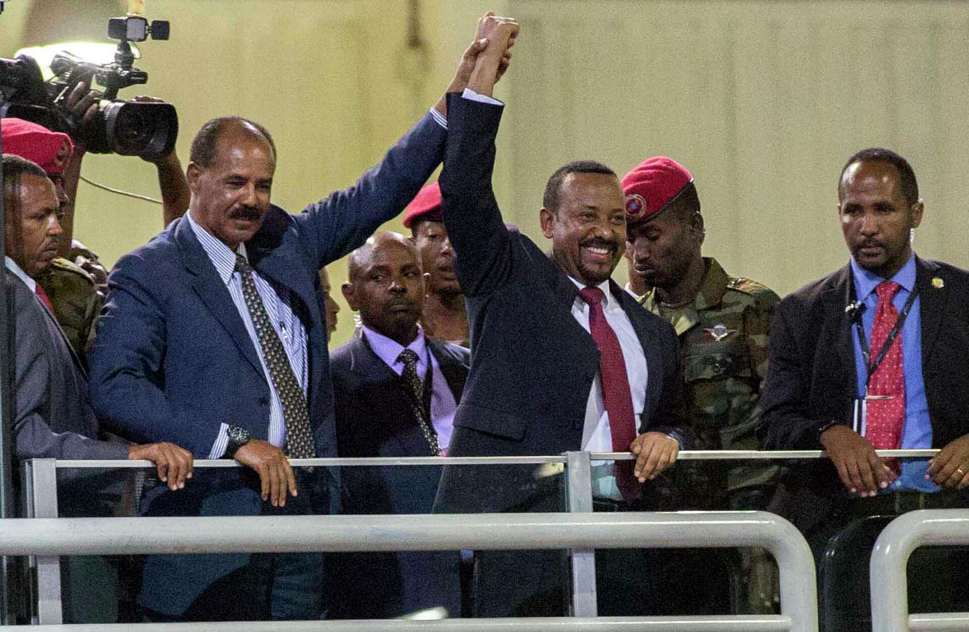 In this Sunday July 15, 2018 file photo, Eritrean President Isaias Afwerki, second left, and Ethiopia's Prime Minister Abiy Ahmed, center, hold hands as they wave at the crowds in Addis Ababa, Ethiopia. Once official rivals, the leaders of Ethiopia and Eritrea have embraced warmly to the roar of a crowd of thousands at a concert celebrating the end of a long state of war. The 2019 Nobel Peace Prize was given to Ethiopian Prime Minister Abiy Ahmed on Friday Oct. 11, 2019. - Sputnik International, 1920, 24.08.2022