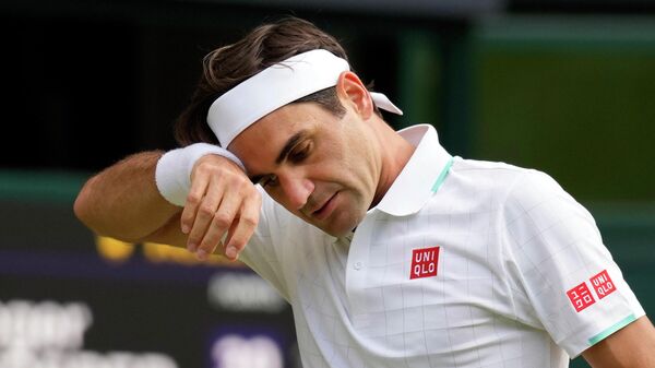 FILE - In this July 7, 2021, file photo, Switzerland's Roger Federer wipes his brow during the men's singles quarterfinals match against Poland's Hubert Hurkacz on day nine of the Wimbledon Tennis Championships in London - Sputnik International