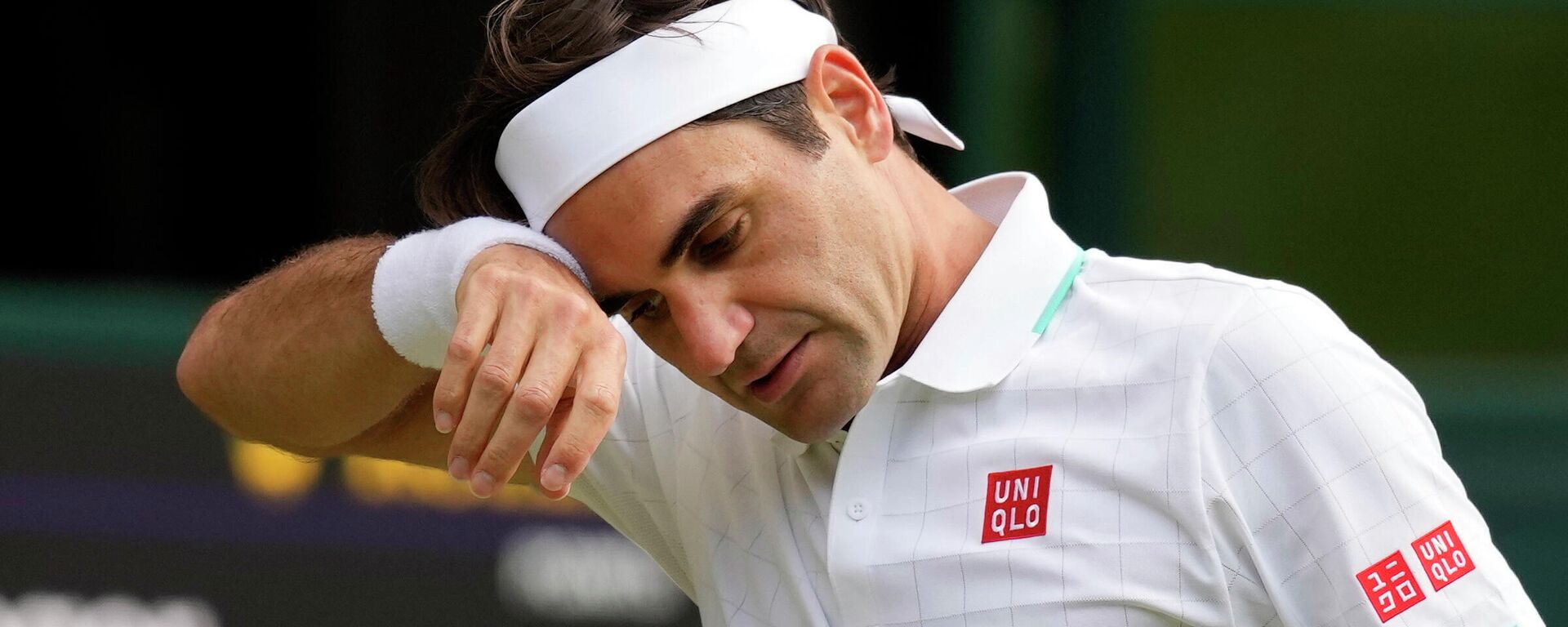 FILE - In this July 7, 2021, file photo, Switzerland's Roger Federer wipes his brow during the men's singles quarterfinals match against Poland's Hubert Hurkacz on day nine of the Wimbledon Tennis Championships in London - Sputnik International, 1920, 13.07.2022