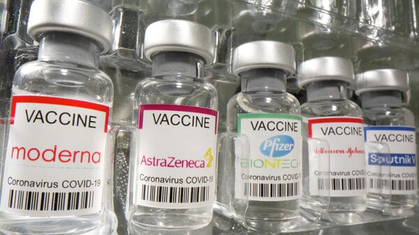 Vials labelled Moderna, AstraZeneca, Pfizer - Biontech, Johnson&Johnson, Sputnik V coronavirus disease (COVID-19) vaccine - Sputnik International