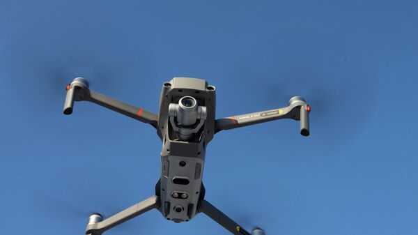 A drone is seen in the sky as Chinese drone maker DJI holds a demonstration to display an app that tracks a drone's registration and owner in Montreal, Canada, November 13, 2019. - Sputnik International