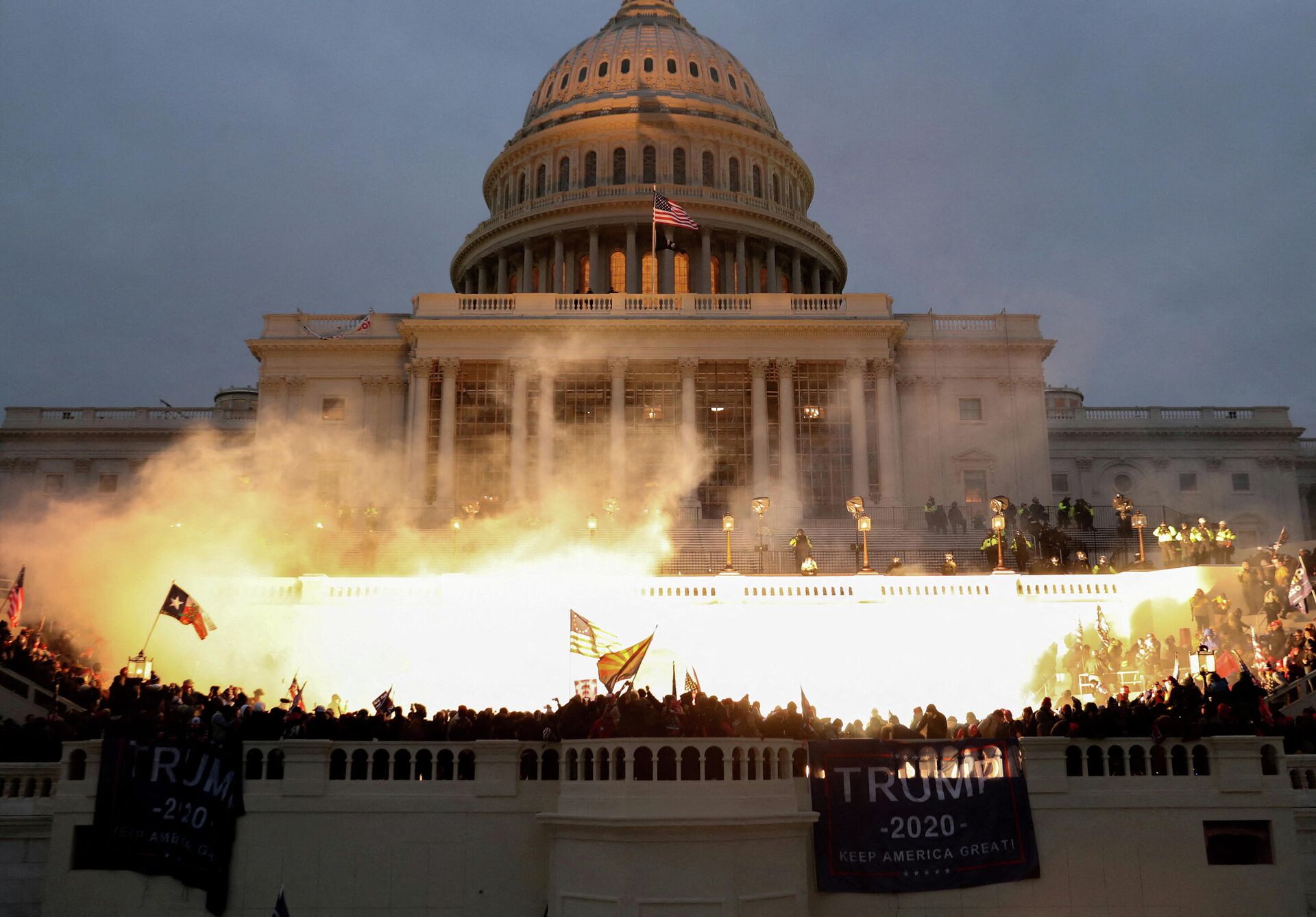 An explosion caused by a police munition is seen while supporters of U.S. President Donald Trump riot in front of the U.S. Capitol Building in Washington, U.S., January 6, 2021 - Sputnik International, 1920, 06.01.2022