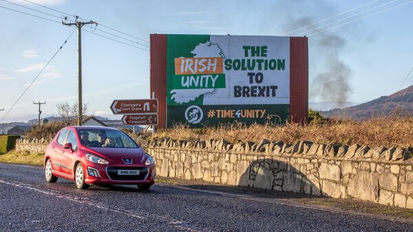 A truck passes signage on the old Dublin road near the border with Northern Ireland and the Irish Republic, on January 1, 2021, as Britain begins life outside the European Union - Sputnik International