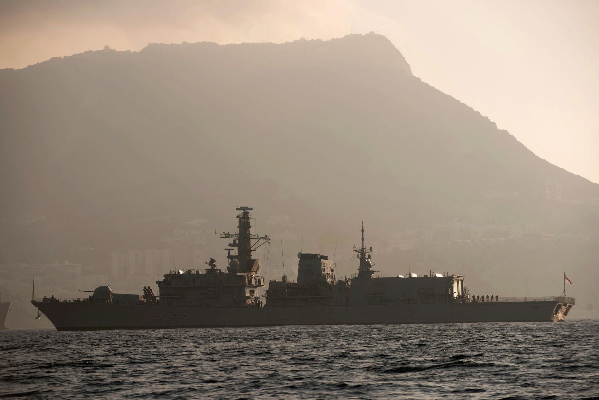 With the rock of Gibraltar in the background, Britain's Royal Navy ship HMS Westminster sails along the Gibraltar stretch near to La Linea de la Concepcion, Spain, Monday, Aug. 19, 2013. The British government said it is considering taking Spain to court if it does not ease border checks on traffic entering the disputed enclave of Gibraltar. Spain has long laid claim to Gibraltar, and the tiny territory on the southern tip of the Iberian peninsula is the source of occasional diplomatic friction between Madrid and London. The latest spat involved an artificial reef being built in Gibraltar that Spain said is hurting its fishermen. It also floated the idea of charging people entering and leaving Gibraltar 50 euros ($66) to provide compensation for the losses that the fishermen face.  - Sputnik International, 1920, 26.12.2021