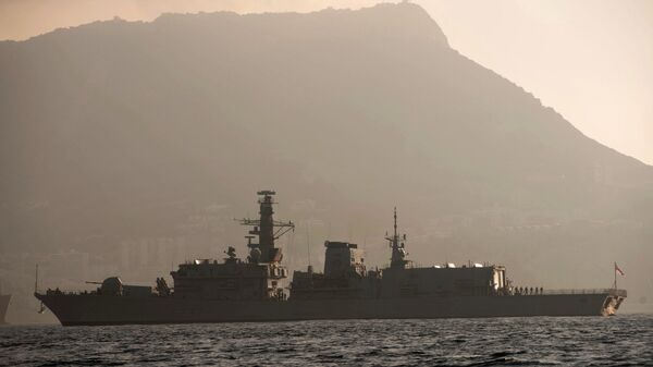 With the rock of Gibraltar in the background, Britain's Royal Navy ship HMS Westminster sails along the Gibraltar stretch near to La Linea de la Concepcion, Spain, Monday, Aug. 19, 2013. The British government said it is considering taking Spain to court if it does not ease border checks on traffic entering the disputed enclave of Gibraltar. Spain has long laid claim to Gibraltar, and the tiny territory on the southern tip of the Iberian peninsula is the source of occasional diplomatic friction between Madrid and London. The latest spat involved an artificial reef being built in Gibraltar that Spain said is hurting its fishermen. It also floated the idea of charging people entering and leaving Gibraltar 50 euros ($66) to provide compensation for the losses that the fishermen face.  - Sputnik International
