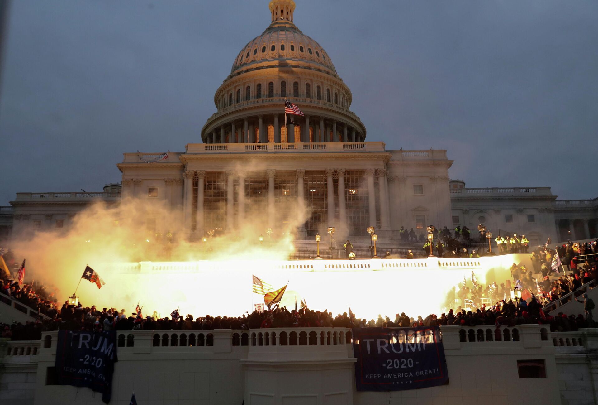 An explosion caused by a police munition is seen while supporters of U.S. President Donald Trump riot in front of the U.S. Capitol Building in Washington, U.S., January 6, 2021. - Sputnik International, 1920, 06.01.2022