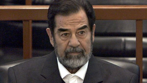 In this Dec. 6, 2006 file photo, former Iraq leader Saddam Hussein sits in court in Baghdad, Iraq, during the Anfal trial against him - Sputnik International