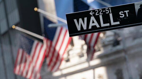 A sign for Wall Street hangs in front of the New York Stock Exchange, July 8, 2021. - Sputnik International