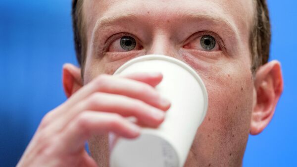 In this April 11, 2018, file photo, Facebook CEO Mark Zuckerberg takes a drink of water as he testifies before a House Energy and Commerce hearing on Capitol Hill in Washington.  - Sputnik International