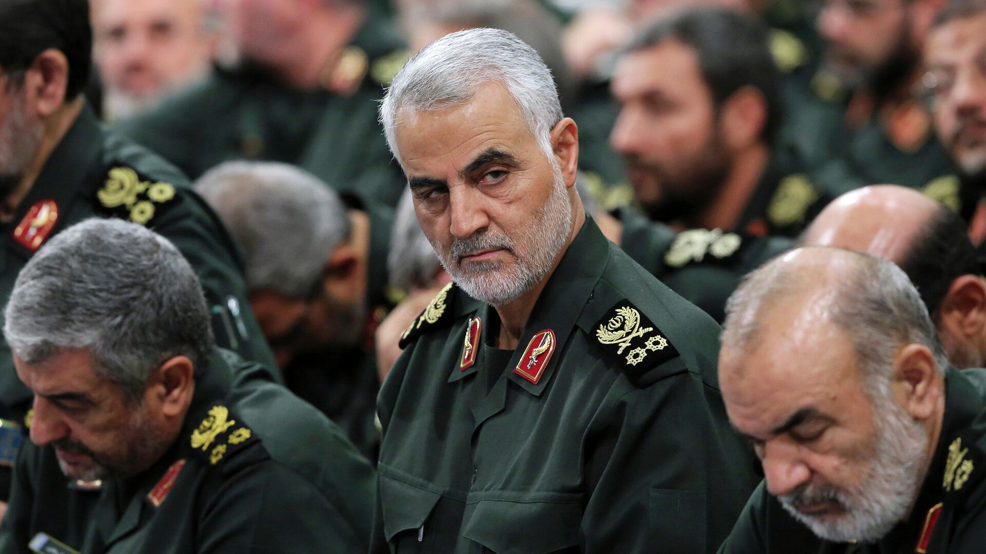 In this Sept. 18, 2016, file photo provided by an official website of the office of the Iranian supreme leader, Revolutionary Guard Gen. Qassem Soleimani, center, attends a meeting in Tehran, Iran. Iran executed Mahmoud Mousavi Majd convicted of providing information to the United States and Israel about the prominent Revolutionary Guard general later killed by a U.S. drone strike, state TV reported on Monday, July 20, 2020. (Office of the Iranian Supreme Leader via AP, File) - Sputnik International, 1920, 31.12.2021