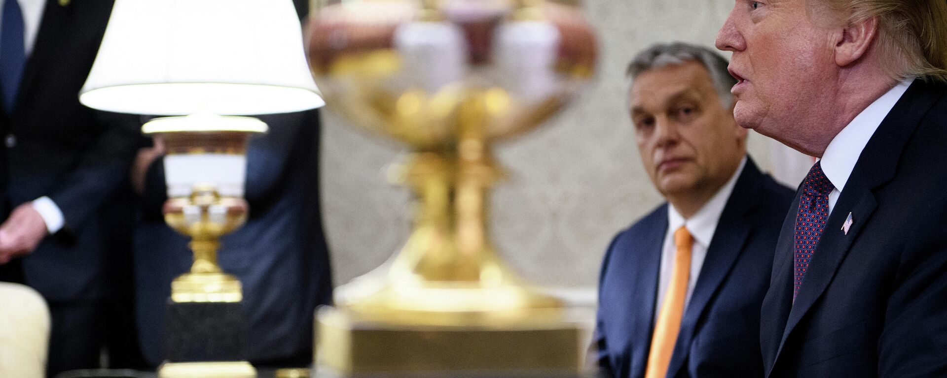 In this file photo taken on May 13, 2019 Hungary's Prime Minister Viktor Orban listens while US President Donald Trump speaks to the press before a meeting in the Oval Office of the White House in Washington, DC. - Sputnik International, 1920, 05.11.2023