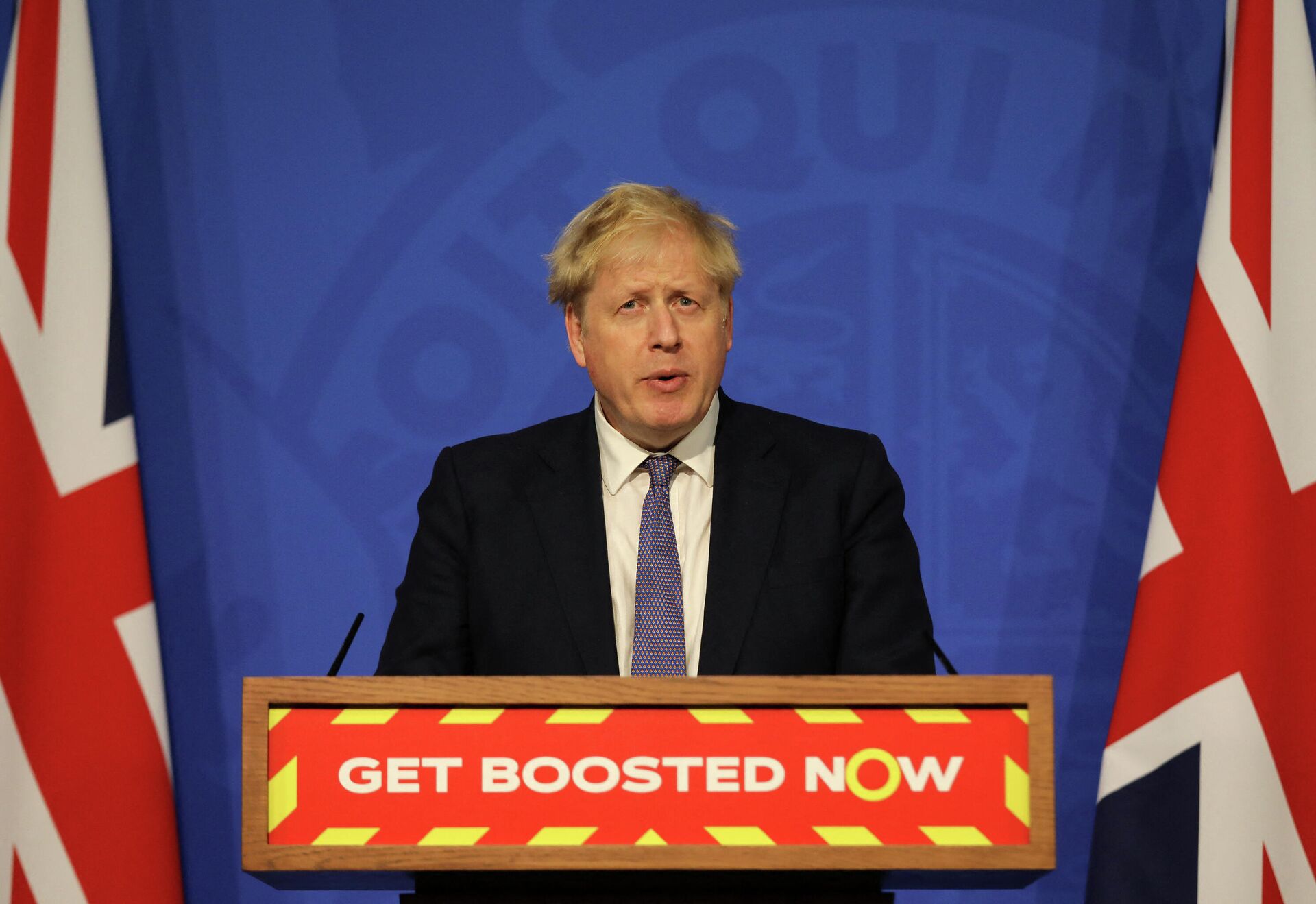 Britain's Prime Minister Boris Johnson speaks during a virtual press conference to update the nation on the status of the Covid-19 pandemic, in the Downing Street briefing room in central London on January 4, 2022. - Sputnik International, 1920, 14.01.2022