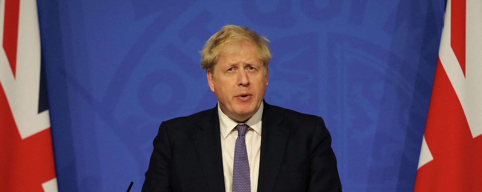 Britain's Prime Minister Boris Johnson speaks during a virtual press conference to update the nation on the status of the Covid-19 pandemic, in the Downing Street briefing room in central London on January 4, 2022. - Sputnik International, 1920, 08.01.2022