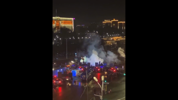 Screenshot captures moments that flash grenades were deployed in Almaty, Kazakhstan amid ongoing protests over gas prices. - Sputnik International