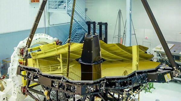 The gold-covered primary mirrors of the James Webb Space Telescope, revealed in the cleanroom at NASA Goddard. - Sputnik International