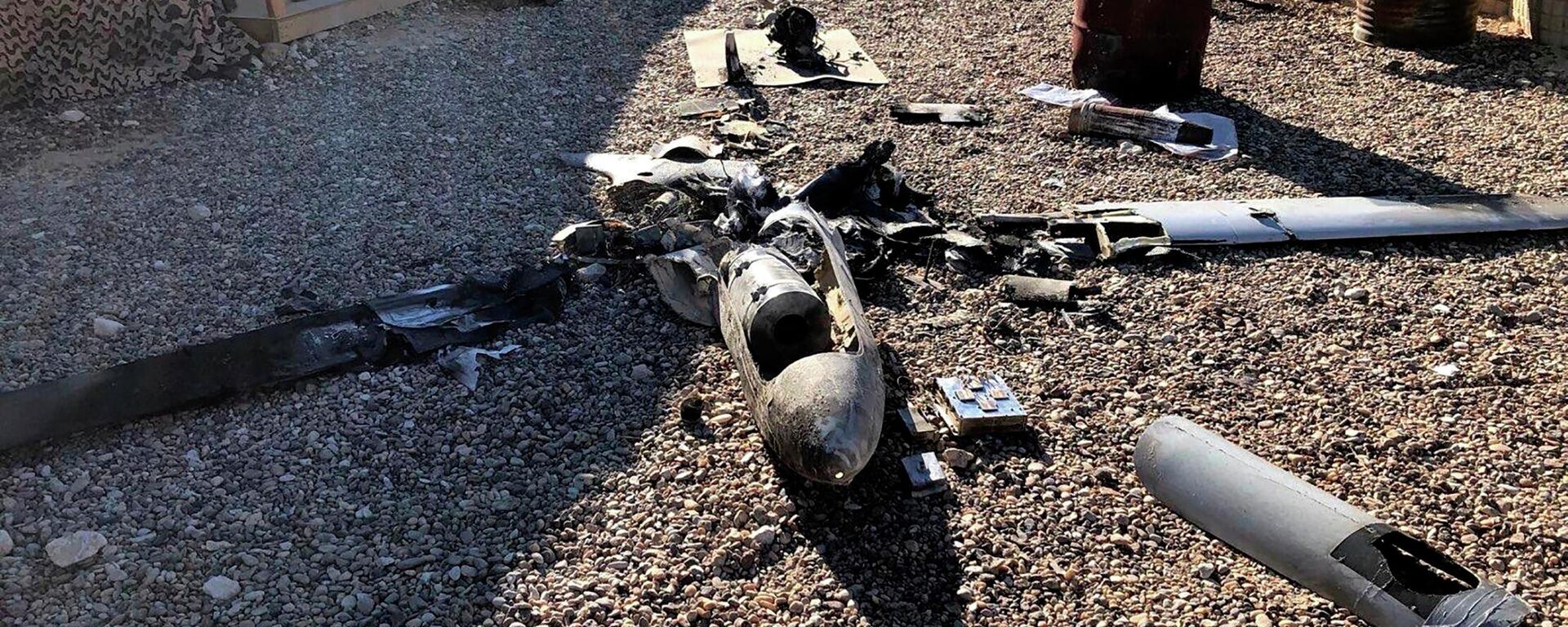 Parts of the wreckage of a drone are laid out on the ground near the Ain al-Asad airbase, in the western Anbar province of Iraq, Tuesday, Jan. 4, 2022. - Sputnik International, 1920, 15.11.2023