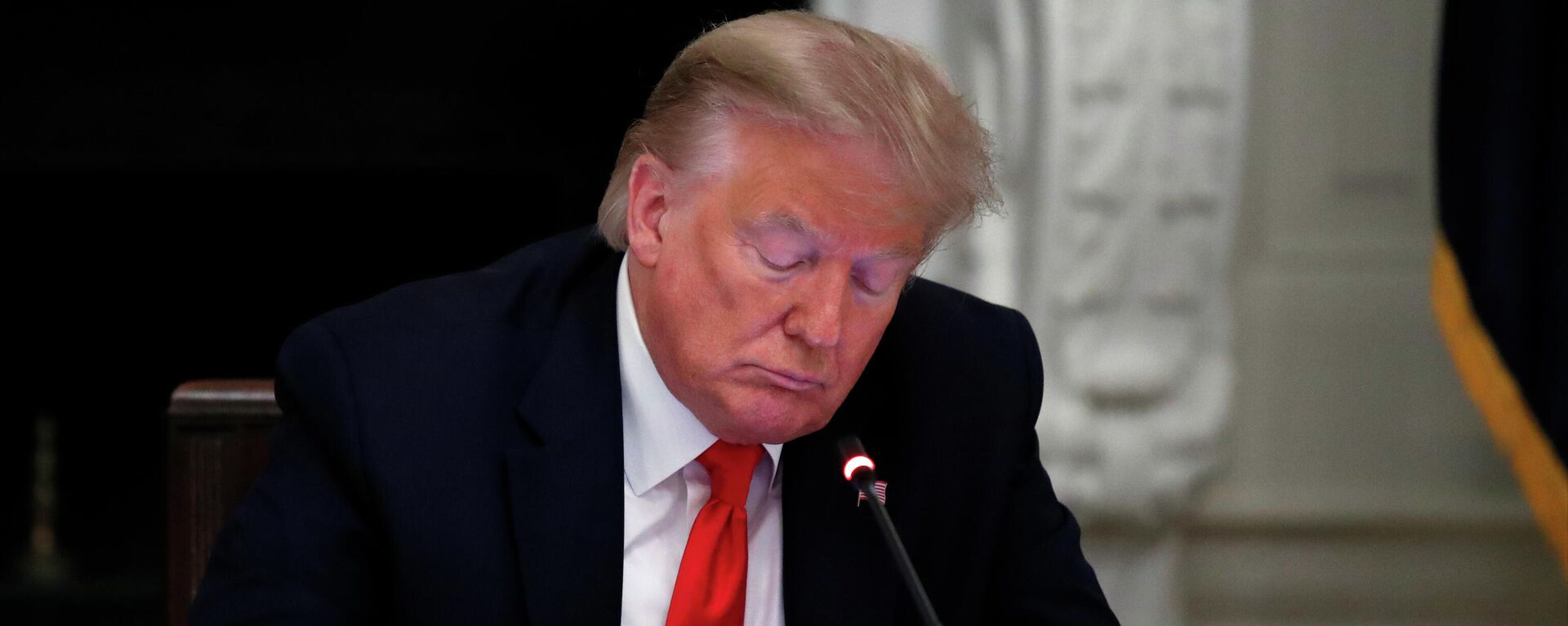  In this Thursday, June 18, 2020 file photo, President Donald Trump looks at his phone during a roundtable with governors on the reopening of America's small businesses, in the State Dining Room of the White House in Washington. - Sputnik International, 1920, 07.01.2022