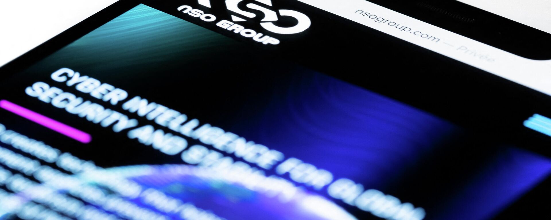 This studio photographic illustration shows a smartphone with the website of Israel's NSO Group which features 'Pegasus' spyware, on display in Paris on July 21, 2021. - Private Israeli firm NSO Group has denied media reports its Pegasus software is linked to the mass surveillance of journalists and rights defenders, and insisted that all sales of its technology are approved by Israel's defence ministry (Photo by JOEL SAGET / AFP) - Sputnik International, 1920, 07.01.2022