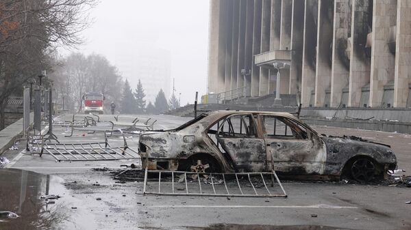 A view shows a burnt car following the protests triggered by fuel price increase outside the city administration headquarters in Almaty, Kazakhstan January 7, 2022. - Sputnik International