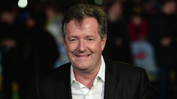 British journalist and television personality Piers Morgan poses for a photograph as he arrives for the European premiere of Eddie The Eagle in London on March 17, 2016 - Sputnik International