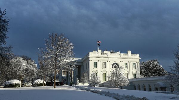 Late afternoon sunlight hits the West face of the White House  after a winter storm over the capital region on January 3, 2022 in Washington, DC.  - Sputnik International