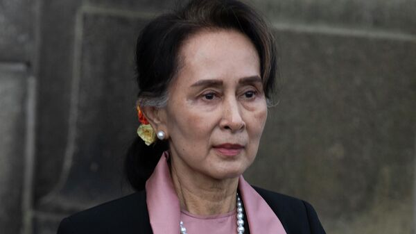 Myanmar's leader Aung San Suu Kyi leaves the International Court of Justice after the first day of three days of hearings in The Hague, Netherlands, on Dec. 10, 2019 - Sputnik International