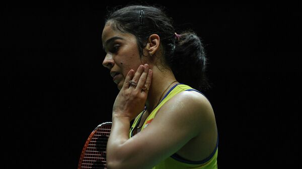 India's Saina Nehwal reacts after loosing a point against Spain's Carolina Marin during their women singles quarter-final match at the Malaysia Open badminton tournament in Kuala Lumpur on January 10, 2020 - Sputnik International