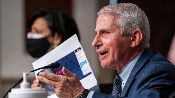 Dr. Anthony Fauci, director of the National Institute of Allergy and Infectious Diseases and chief medical adviser to the president, right, and Dr. Rochelle Walensky, Director of the Centers for Disease Control and Prevention, left, testify before a Senate Health, Education, Labor, and Pensions Committee hearing to examine the federal response to COVID-19 and new emerging variants, Tuesday, Jan. 11, 2022 on Capitol Hill in Washington.  - Sputnik International