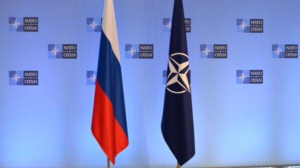 Russian and NATO flags are seen before the Russia - NATO talks in Brussels, Belgium - Sputnik International