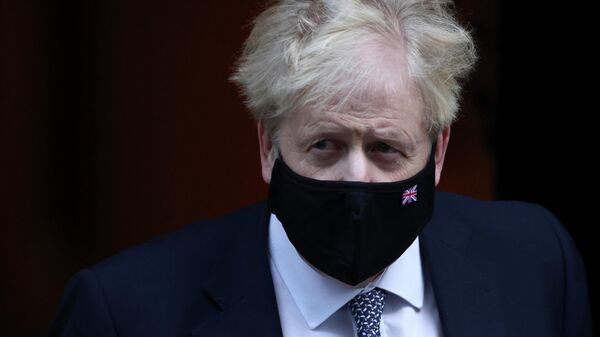 British Prime Minister Boris Johnson walks outside Downing Street in London, Britain, January 12, 2022 - Sputnik International