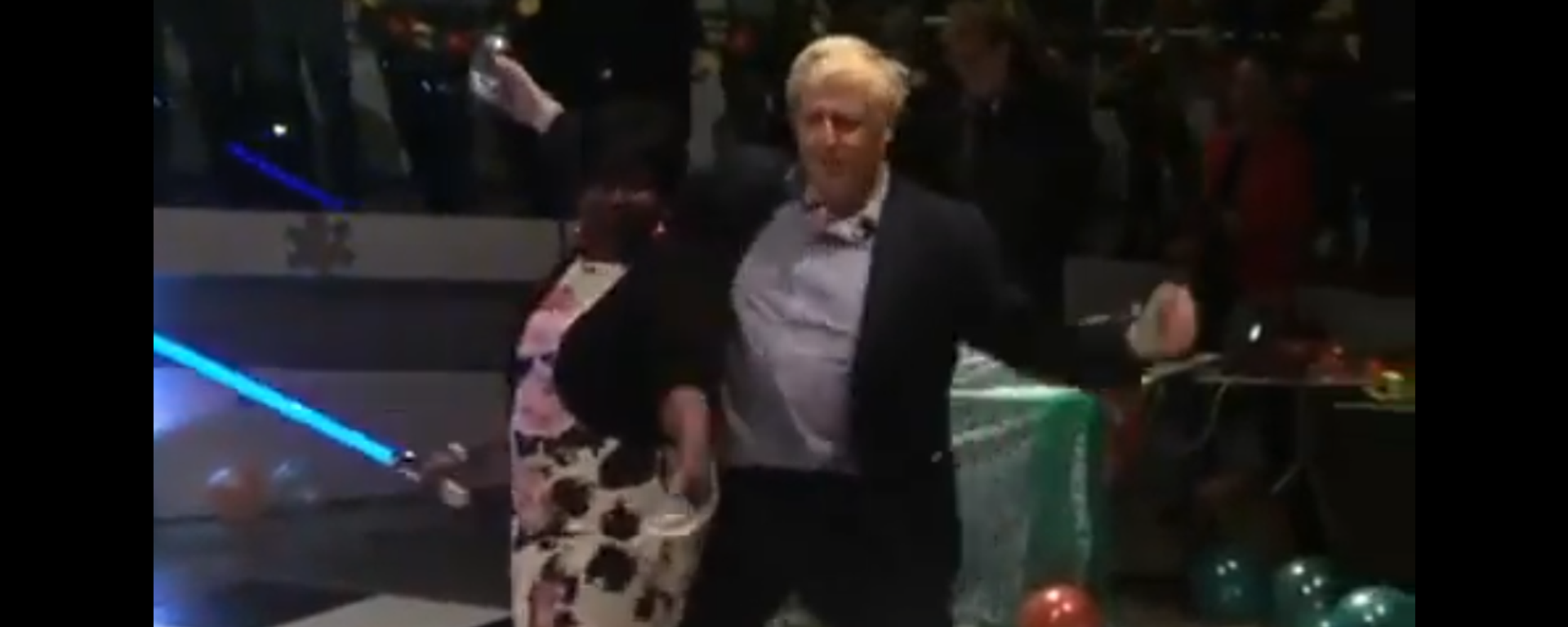 Screenshot from a video showing Boris Johnson dancing with a woman holding a lightsaber - Sputnik International, 1920, 14.01.2022