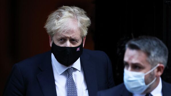 British Prime Minister Johnson walks outside Downing Street in London - Sputnik International