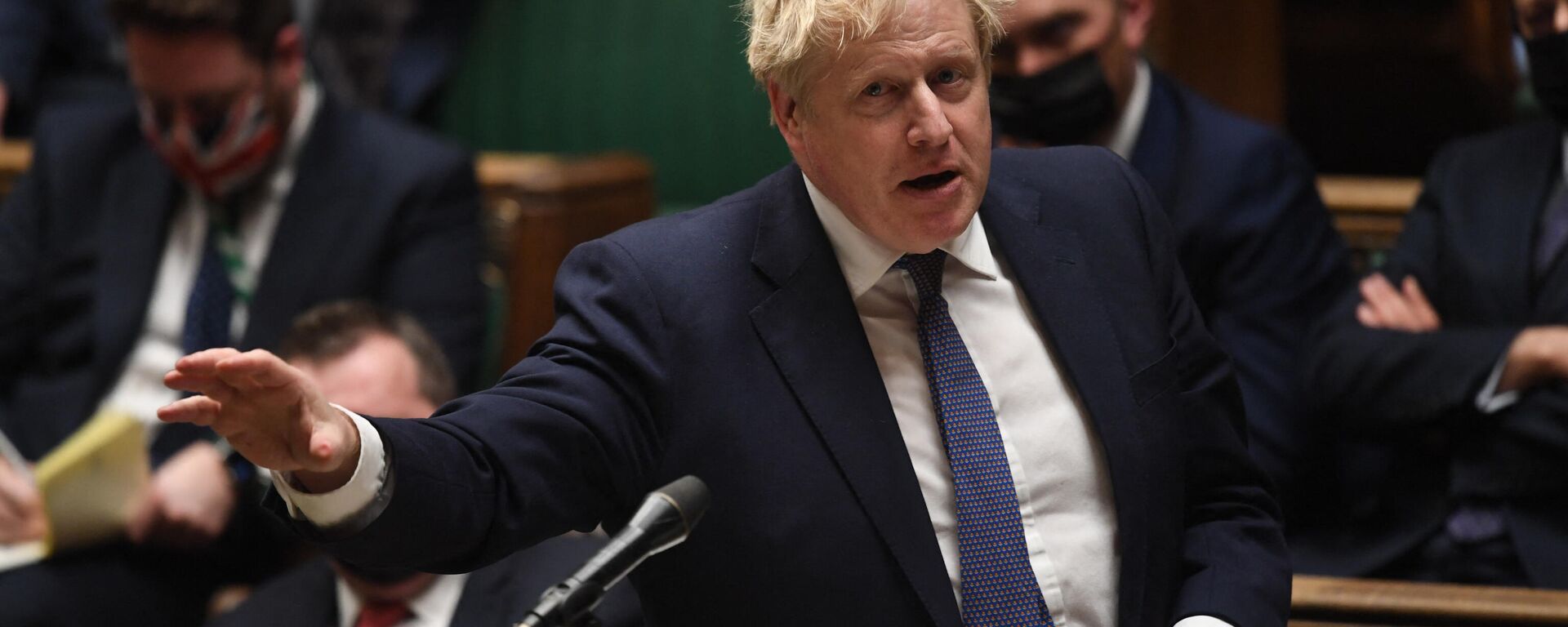 A handout photograph released by the UK Parliament shows Britain's Prime Minister Boris Johnson gesturing during the Prime Minister’s COVID-19 Update in the House of Commons in London on December 15, 2021 - Sputnik International, 1920, 19.01.2022