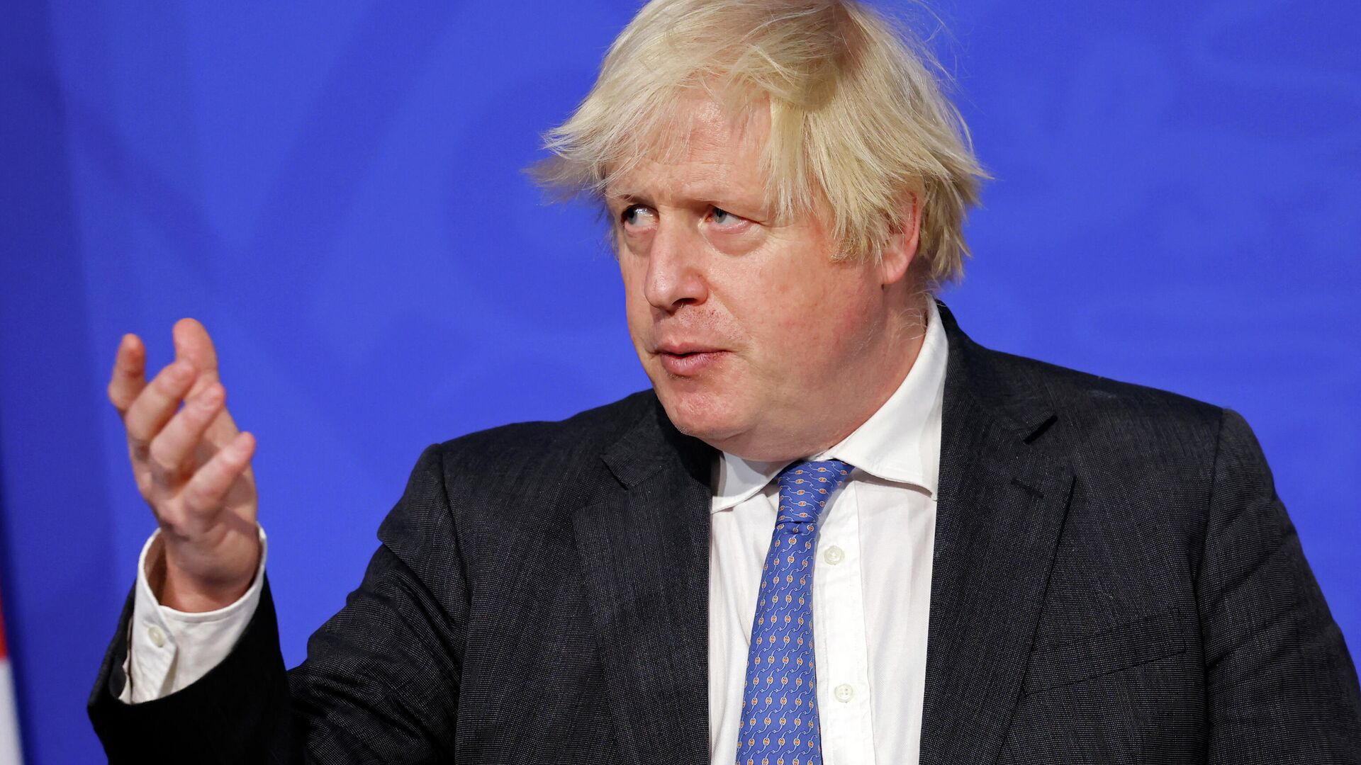 Britain's Prime Minister Boris Johnson speaks at a press conference to update the nation on the Covid-19 booster vaccine program in the Downing Street briefing room in central London on December 15, 2021 - Sputnik International, 1920, 16.01.2022