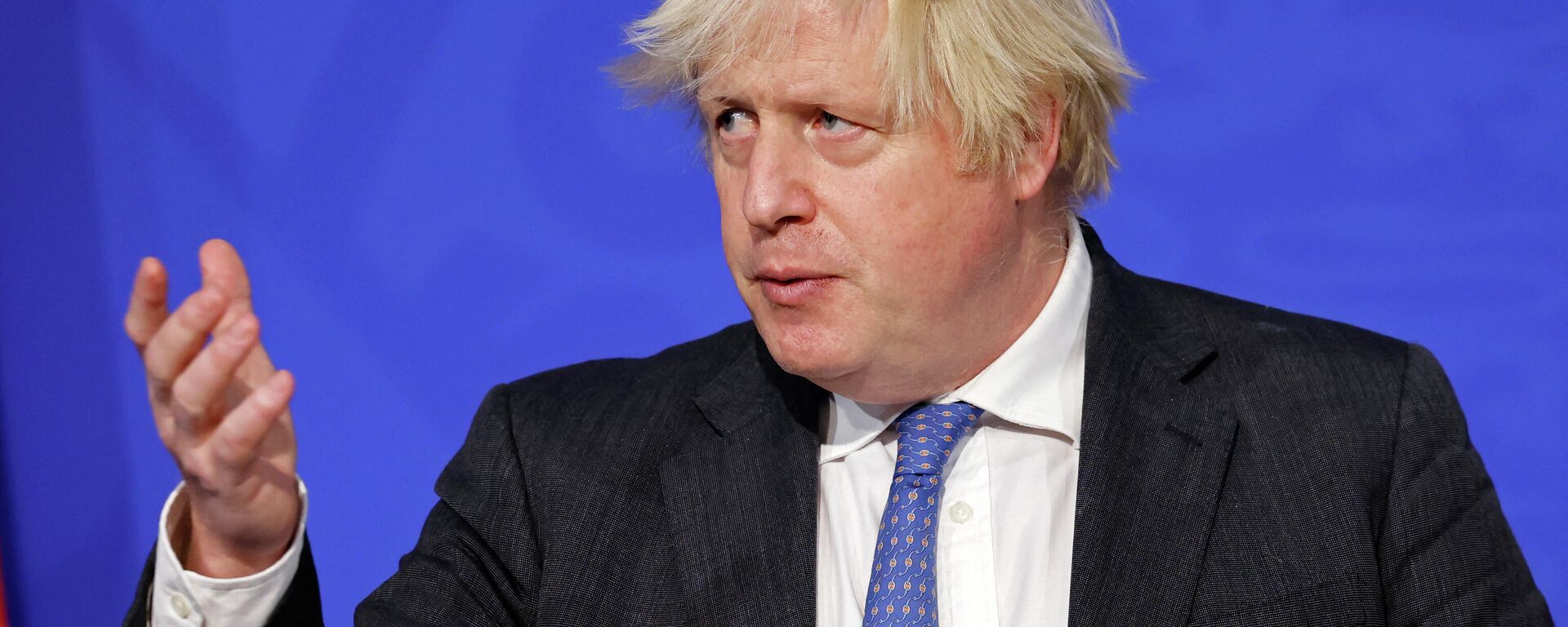 Britain's Prime Minister Boris Johnson speaks at a press conference to update the nation on the Covid-19 booster vaccine program in the Downing Street briefing room in central London on December 15, 2021 - Sputnik International, 1920, 16.01.2022