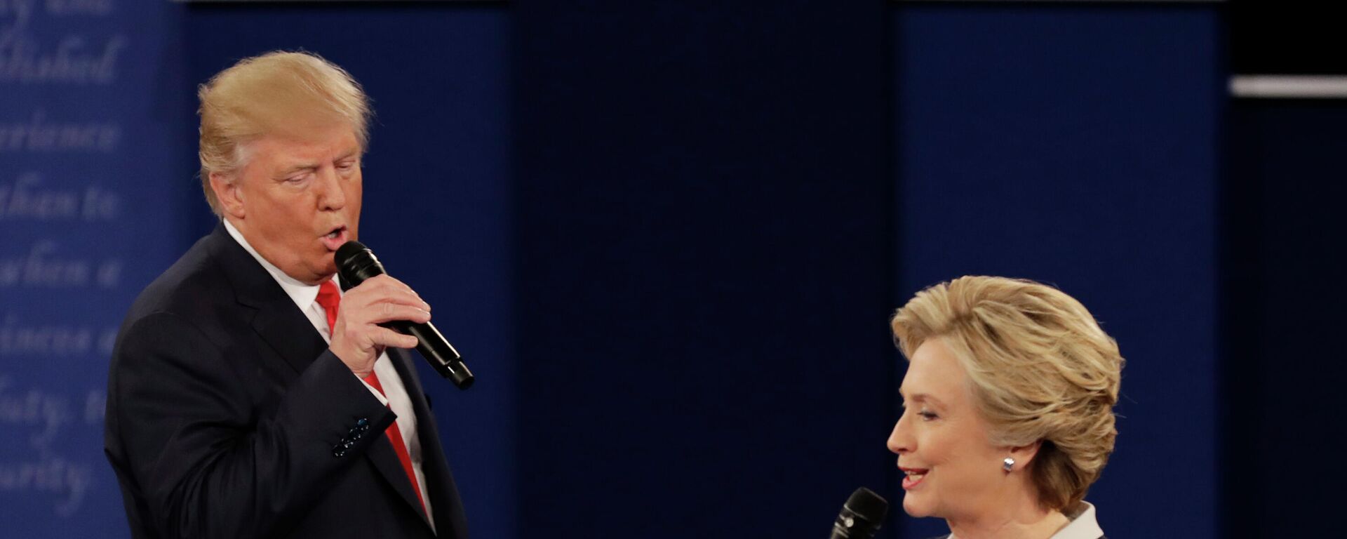 In this Oct. 9, 2016, file photo Republican presidential nominee Donald Trump and Democratic presidential nominee Hillary Clinton speak during the second presidential debate at Washington University in St. Louis. - Sputnik International, 1920, 25.09.2023