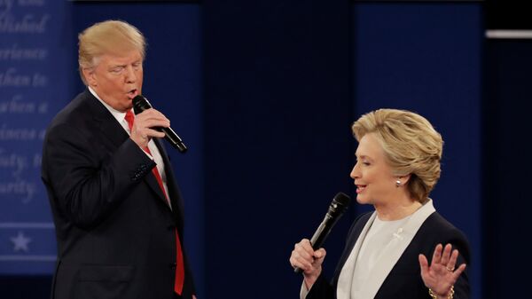 In this Oct. 9, 2016, file photo Republican presidential nominee Donald Trump and Democratic presidential nominee Hillary Clinton speak during the second presidential debate at Washington University in St. Louis. - Sputnik International
