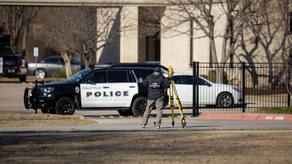 Law enforcement process the scene in front of the Congregation Beth Israel synagogue, Sunday, Jan. 16, 2022, in Colleyville, Texas - Sputnik International